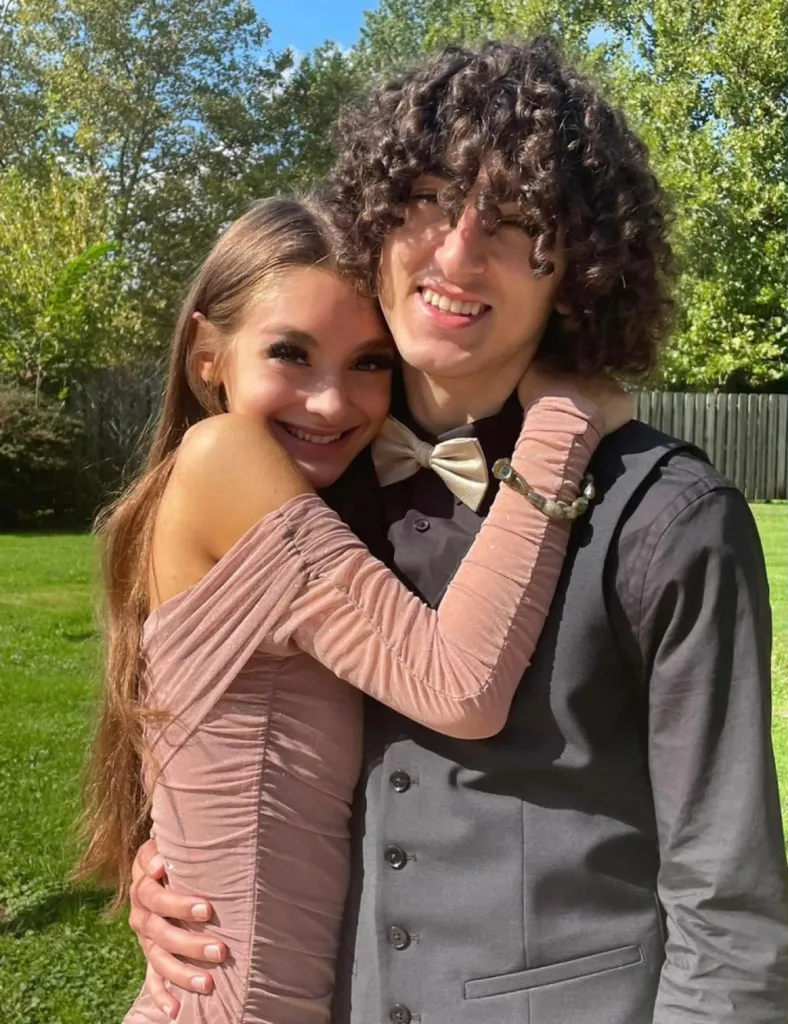 Mackenzie Shirilla and Dominic Russo smiling and embracing.