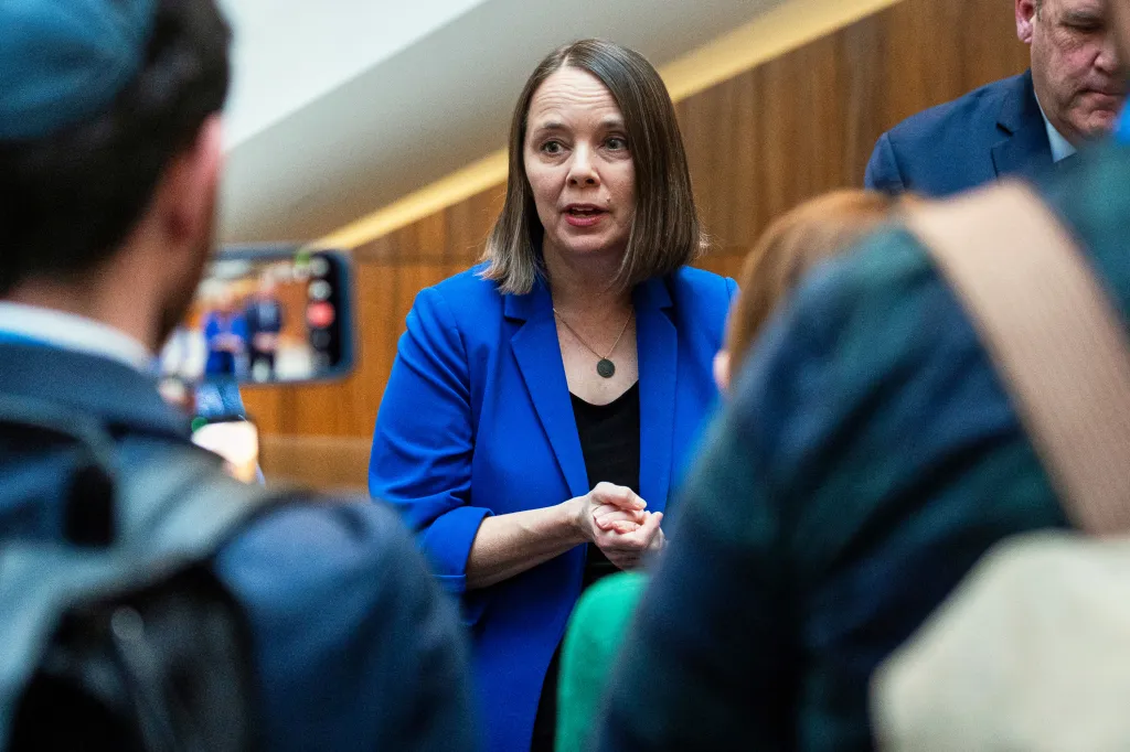 Maine Secretary of State Shenna Bellows speaks with reporters.