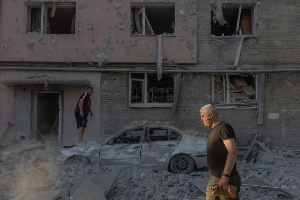 A man walks through a street filled with debris after a Russian strike on a residential building on July 2, 2026.