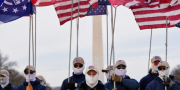 Demonstrators in white supremacist attire protest on Capitol Hill