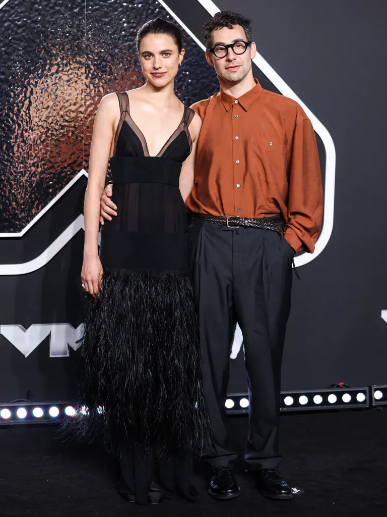 Margaret Qualley and Jack Antonoff posing together at the MTV Video Music Awards.