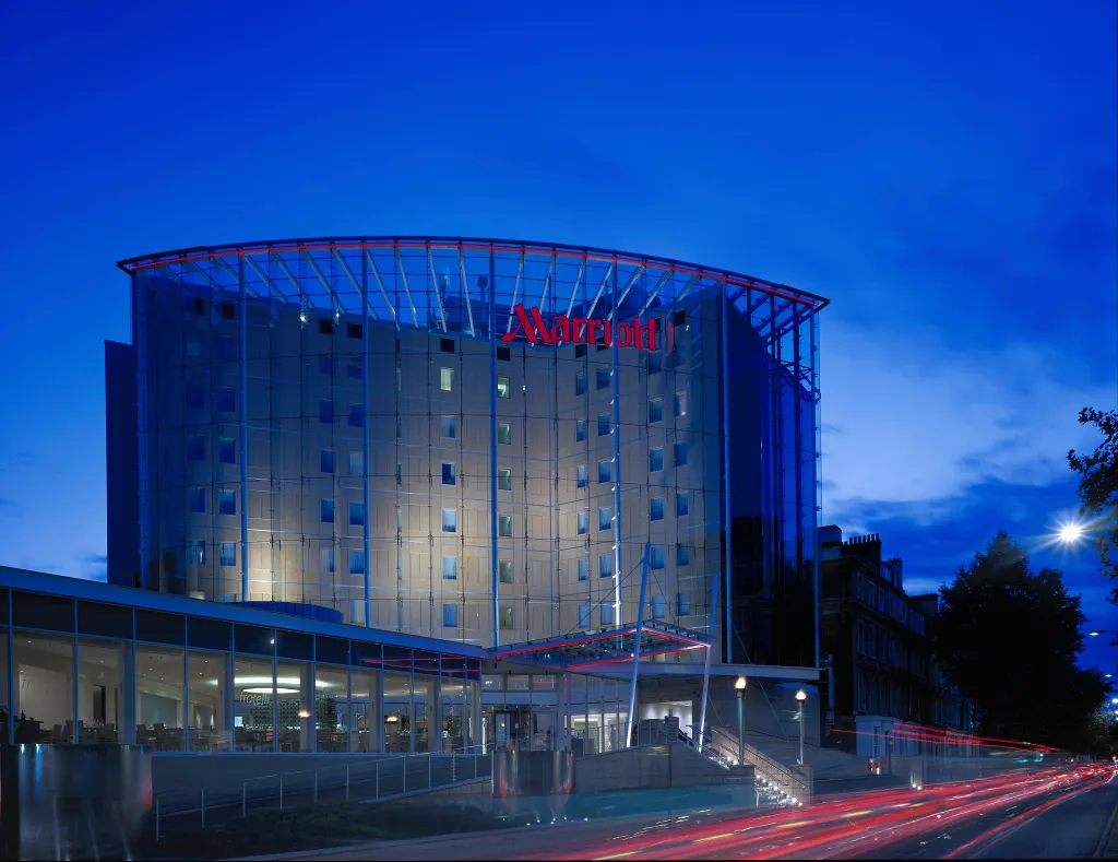 Marriott Hotel in London, United Kingdom at night, with long exposure showing car light trails.
