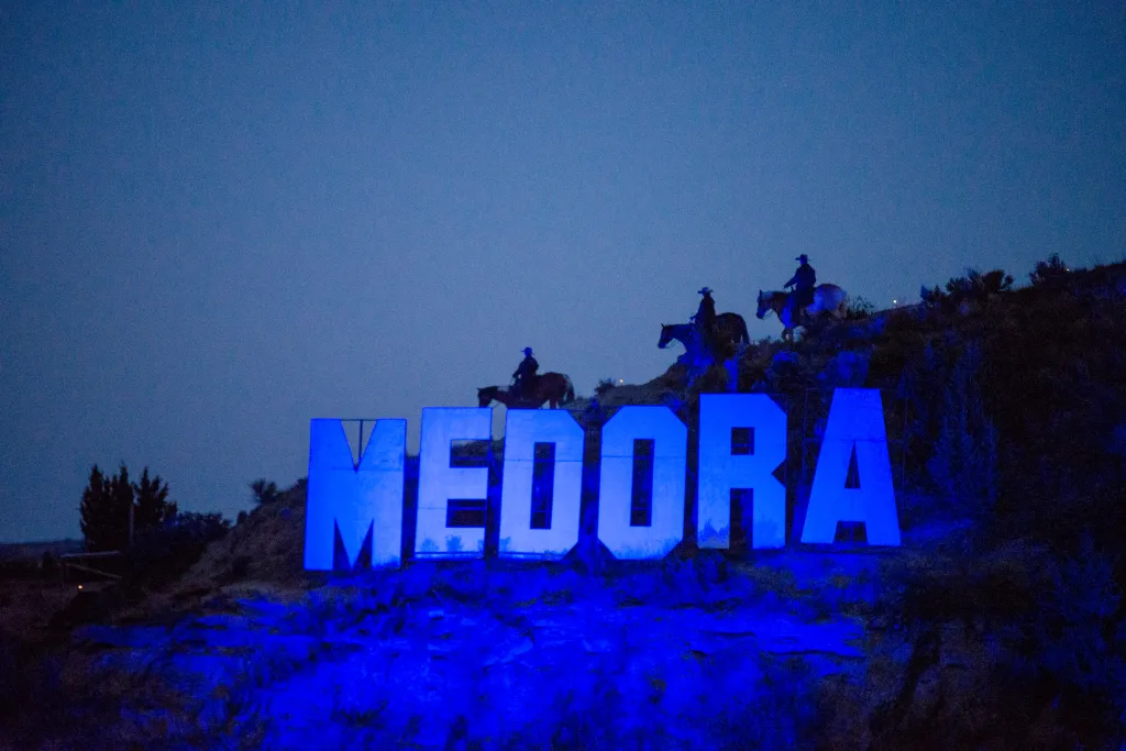 Large illuminated letters spell 