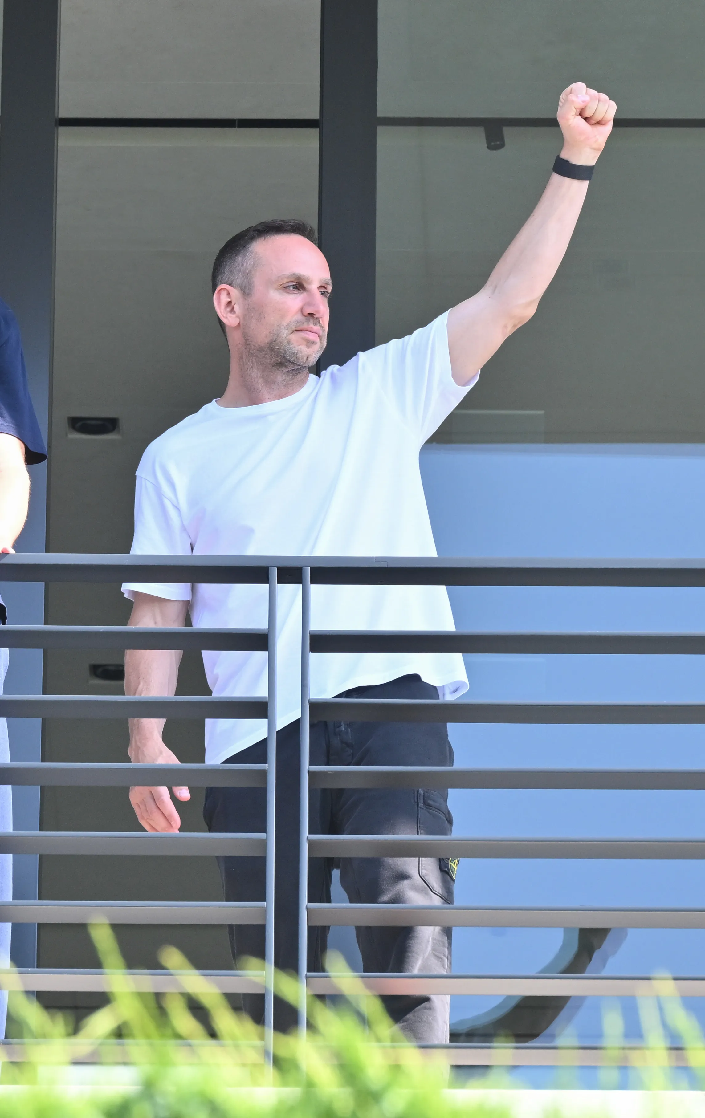 Michael Rubin raising a clenched fist.