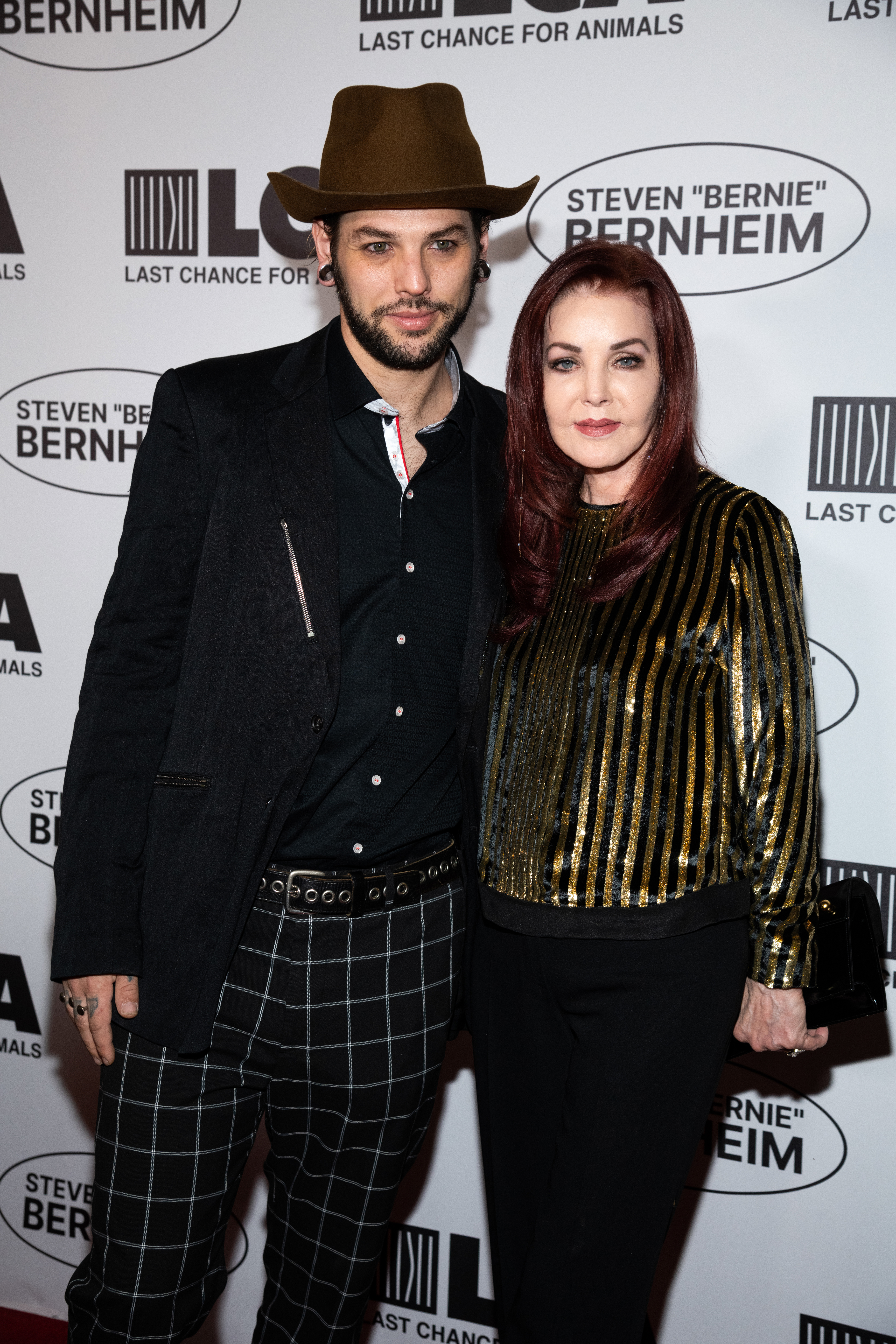 Musician Navarone Garcia and Priscilla Presley posing at the Last Chance For Animals 2022 Compassion Gala.