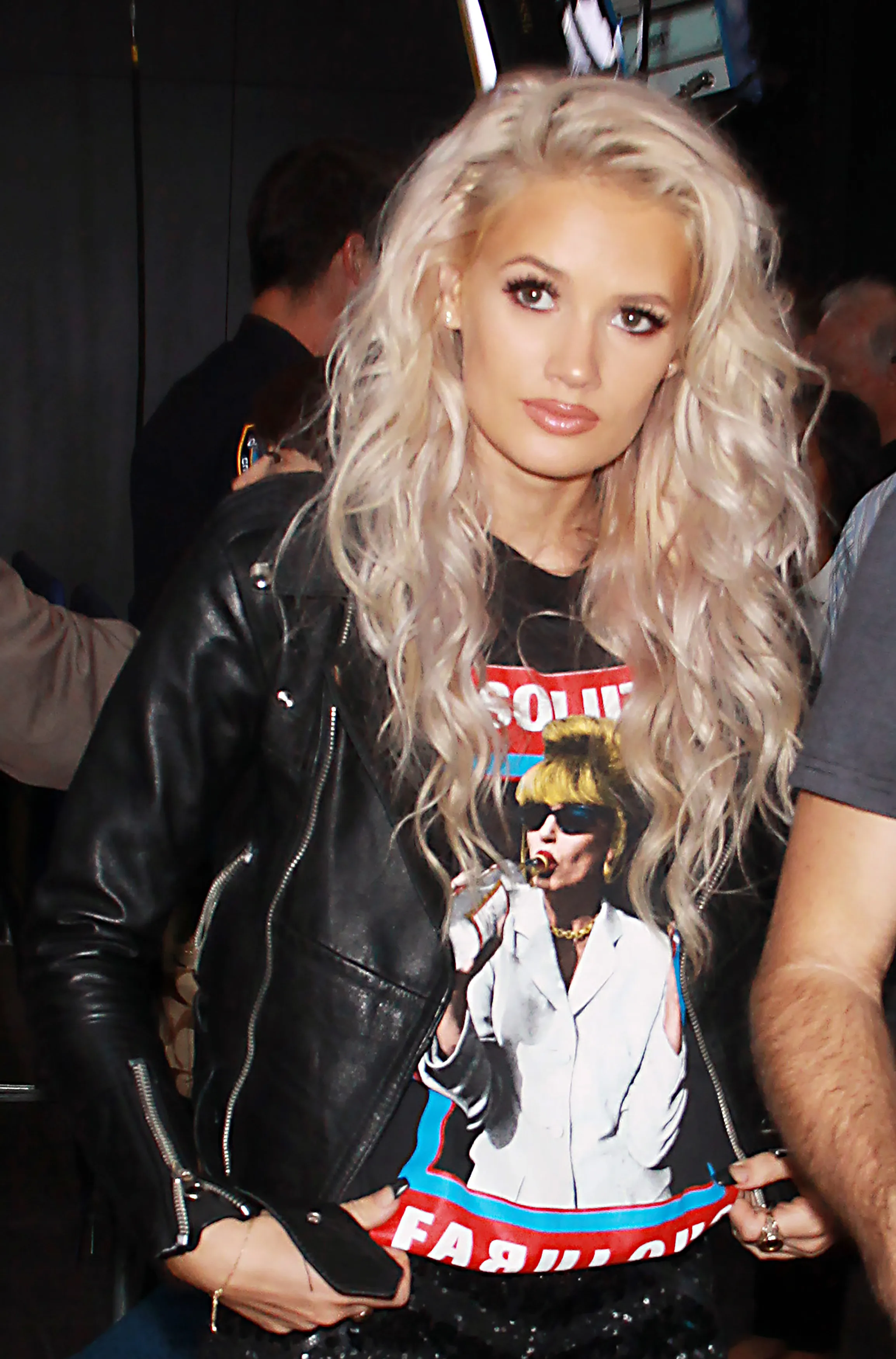 Lauren Bennett of G.R.L. wearing a black leather jacket and a black t-shirt with a graphic print.