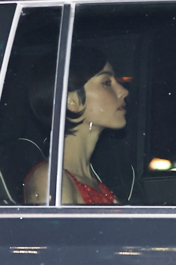 Gracie Abrams seen from the side in a car.