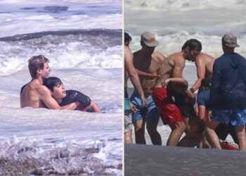 Heart-stopping moment little boy is battered by huge waves and dragged out to sea off California