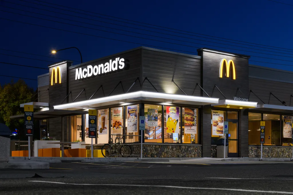 Night view of a modern McDonald's fast-food restaurant with illuminated 