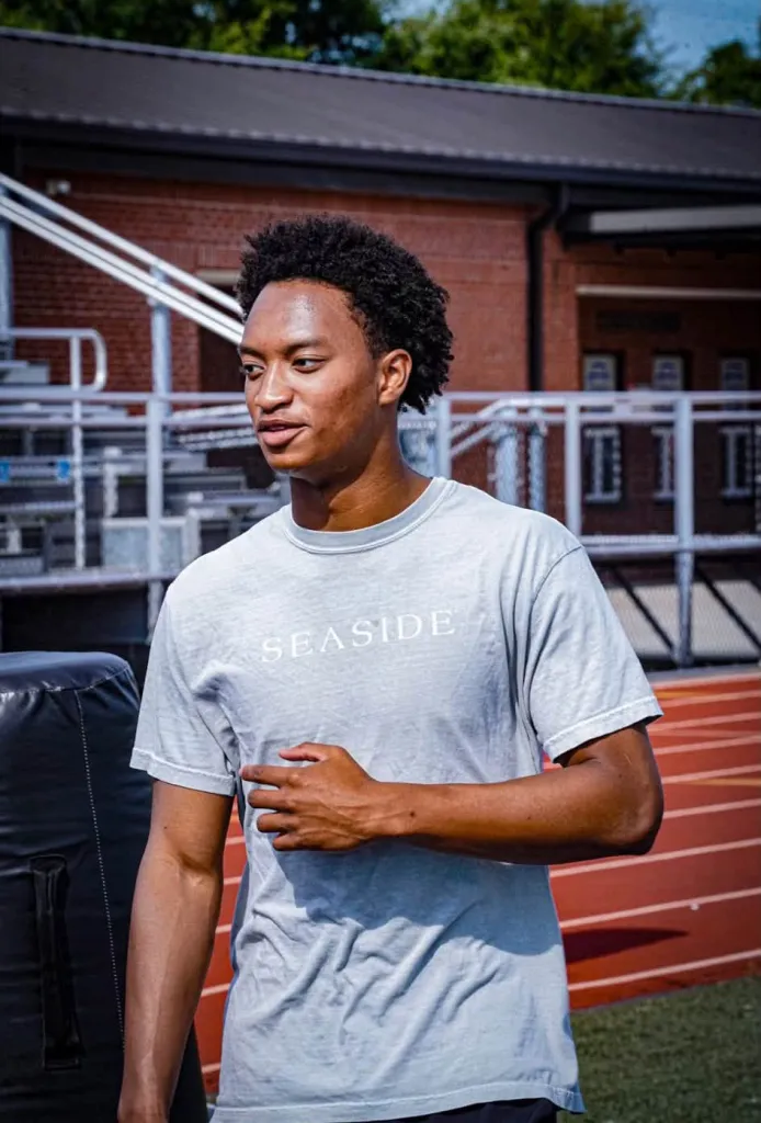 Nolan Wells in a gray t-shirt with 