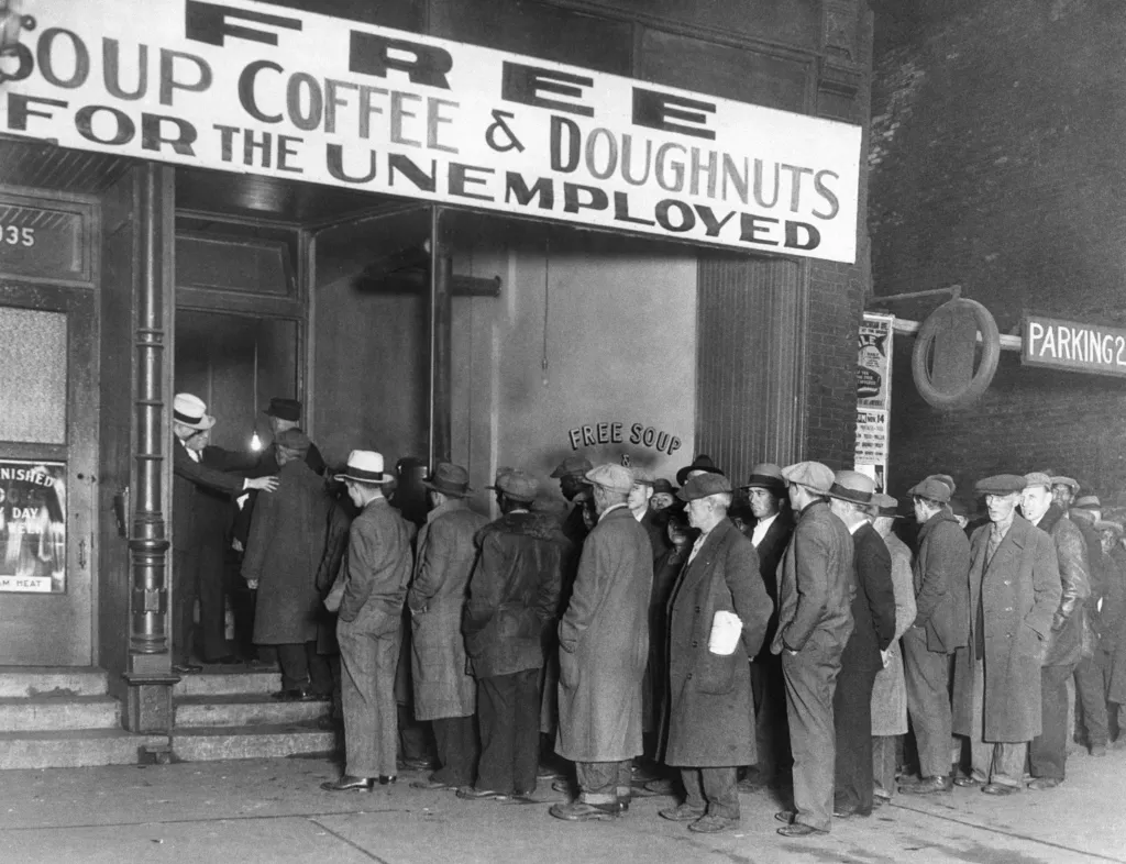 Men queue outside Al Capone's soup kitchen during the Great Depression.