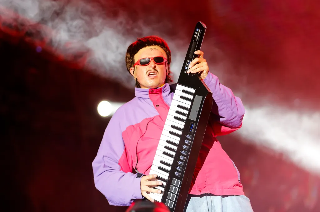 Oliver Tree performs at the Exit Festival 2024, holding a keytar.