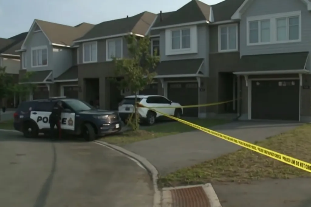 Police line tape around a residential building.