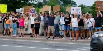 ‘Furious’ protesters descend on small Maine town after ‘horrific’ ICE killing
