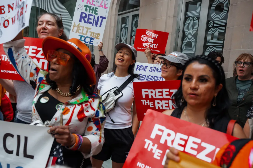 People hold signs and shout ahead of New York City's Rent Guidelines Board rent freeze vote for the city's 1 million rent-regulated apartments, in New York, New York.