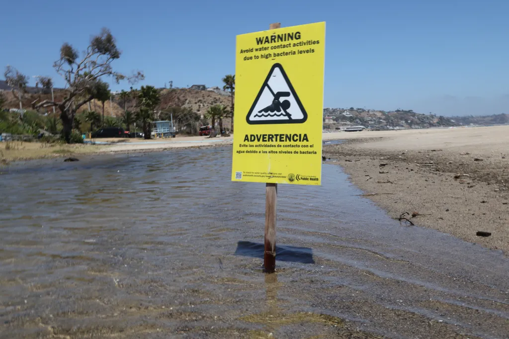 A yellow warning sign, stating