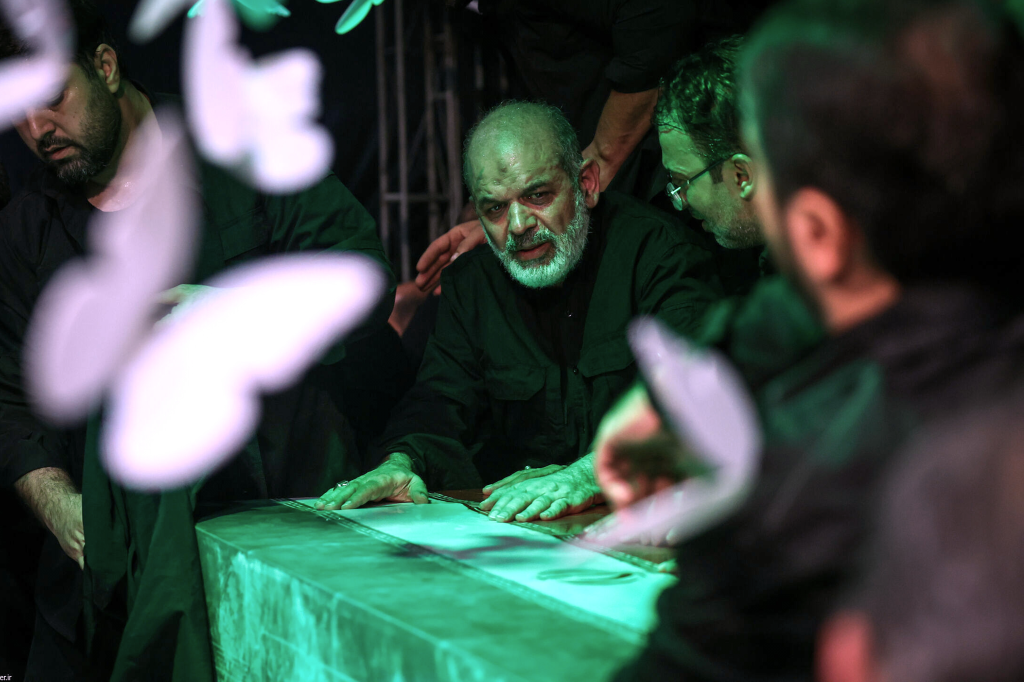 Paramilitary Revolutionary Guard Gen. Ahmad Vahidi sits alongside the casket of Iran's Supreme Leader Ayatollah Ali Khamenei.
