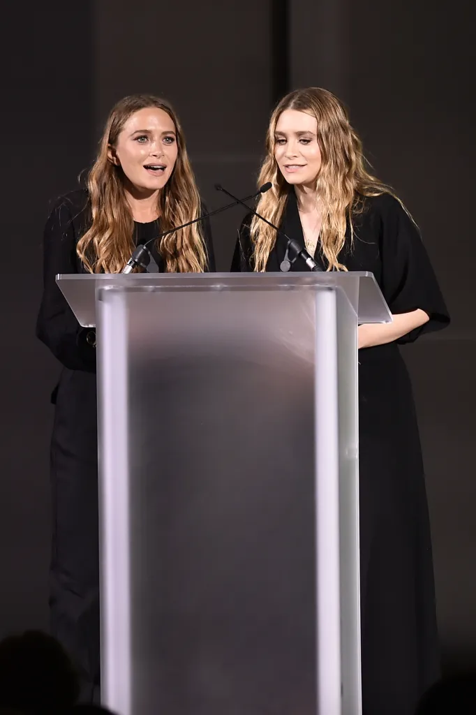 Mary-Kate Olsen and Ashley Olsen speaking at the CFDA Fashion Awards.