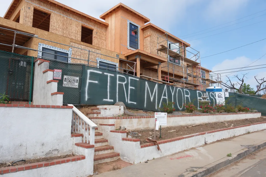Graffiti on a construction site fence in Pacific Palisades reads