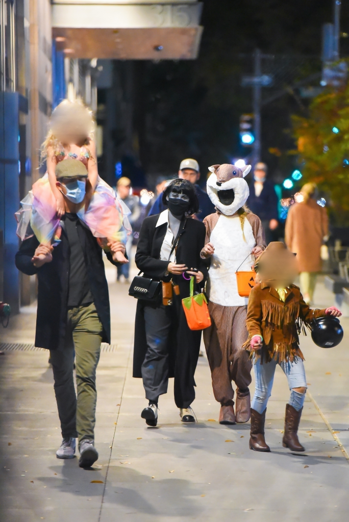 Blake Lively and Ryan Reynolds trick-or-treating with their children in West Village.