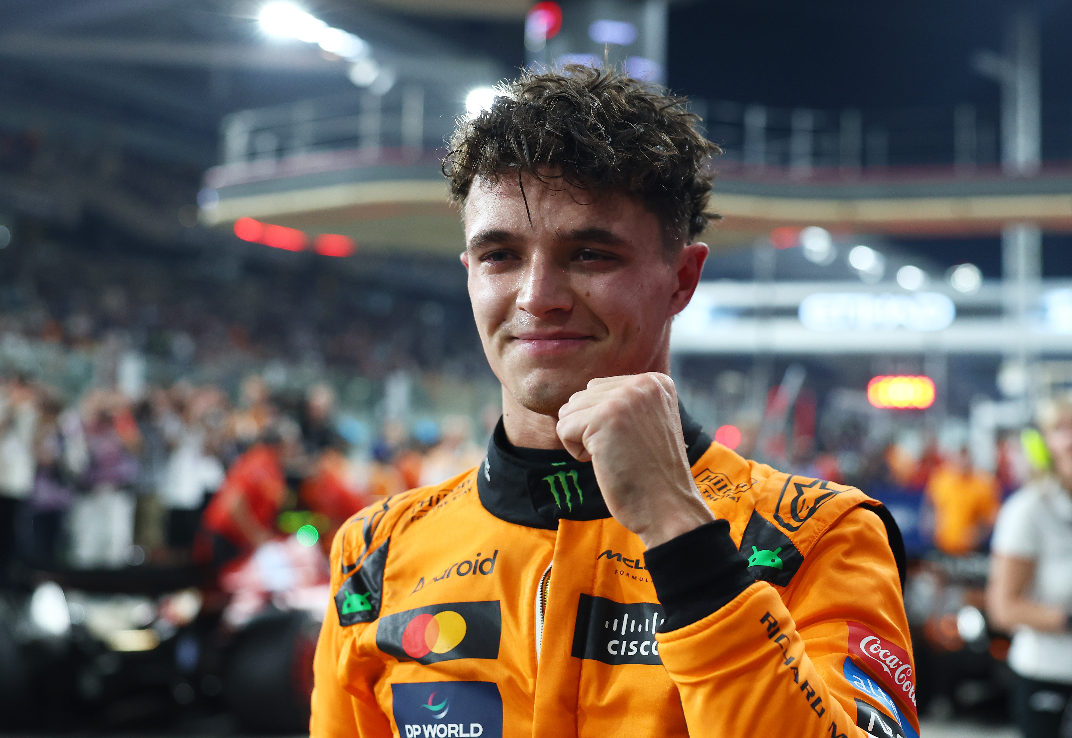 Lando Norris celebrating after qualifying for pole position.