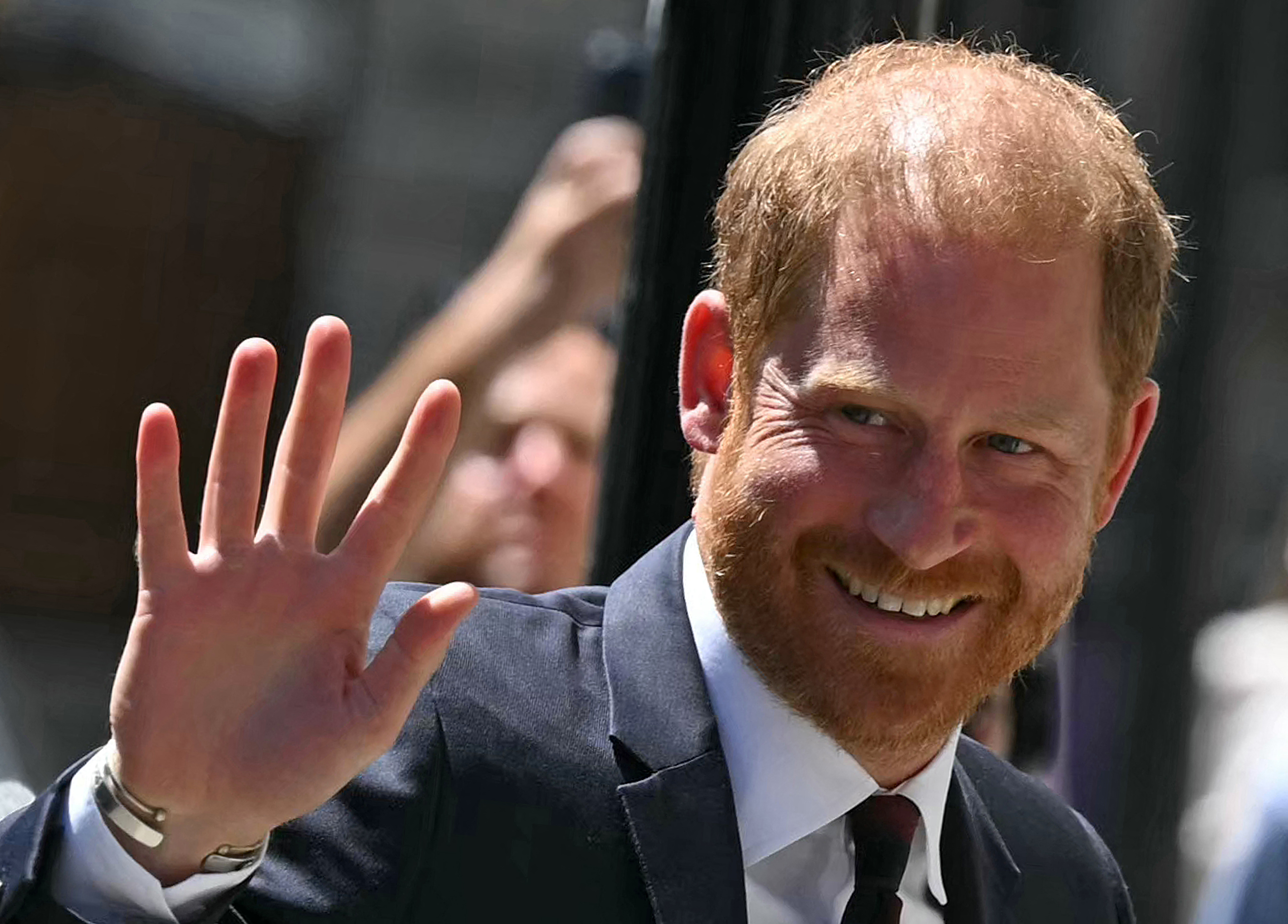 Britain's Prince Harry, Duke of Sussex, waves as he arrives at Chatham House in central London on July 7, 2026