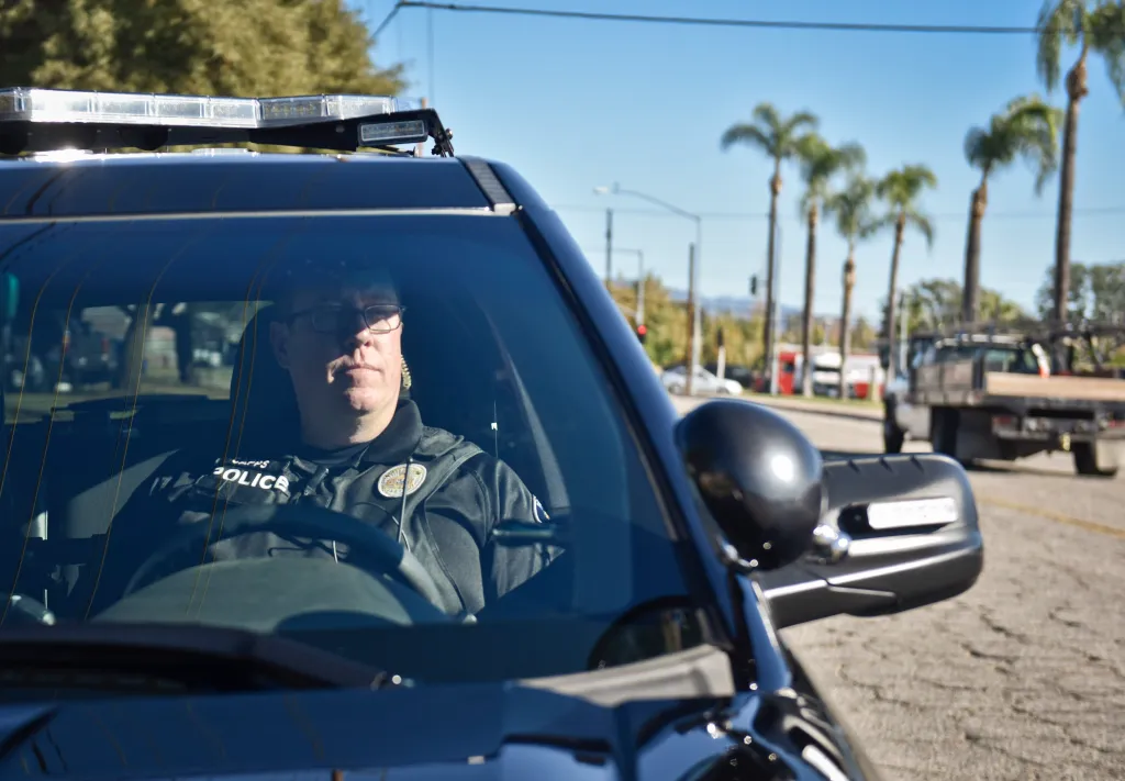 Redlands Police Sergeant Andy Capps in his police cruiser.