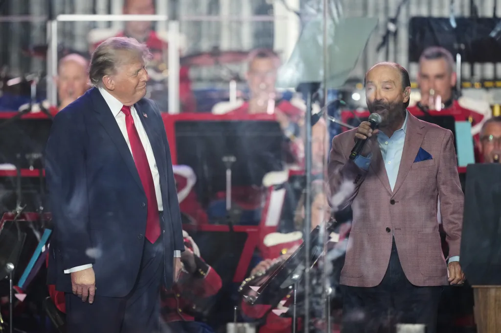 Donald Trump listening to Lee Greenwood perform at the opening of the Great American State Fair.