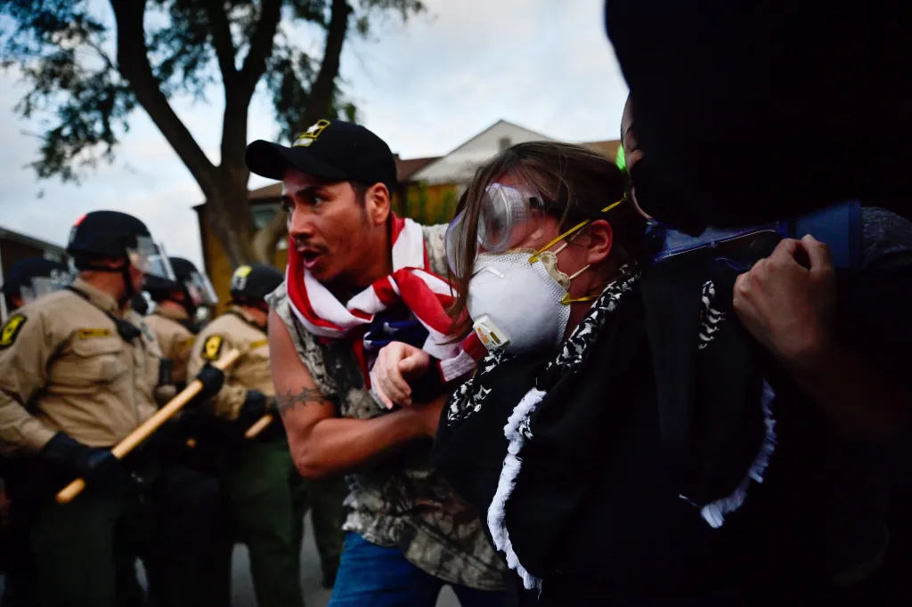 Protesters erupt against federal agents outside an ICE facility in Broadview, Ill., on Oct. 11, 2025.