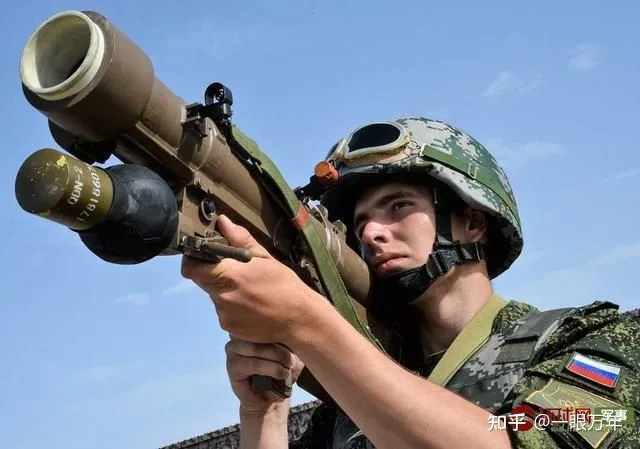 A soldier holds a QW-12 anti-aircraft missile.