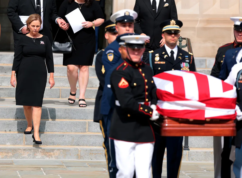 U.S. Sen. Darline Graham Nordone and family watch as a military body bearer team carries the casket of late U.S. Sen. Lindsey Graham.