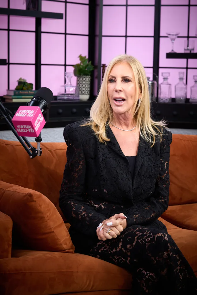 Vicki Gunvalson sitting on a brown couch during an interview.