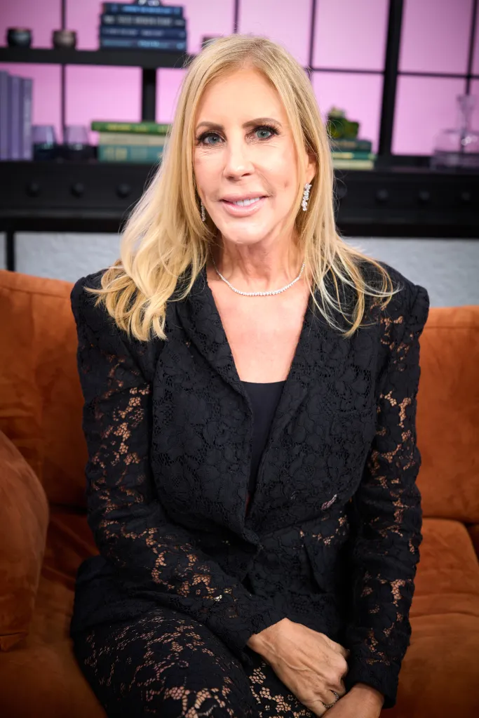Vicki Gunvalson from Real Housewives sitting on a brown couch.