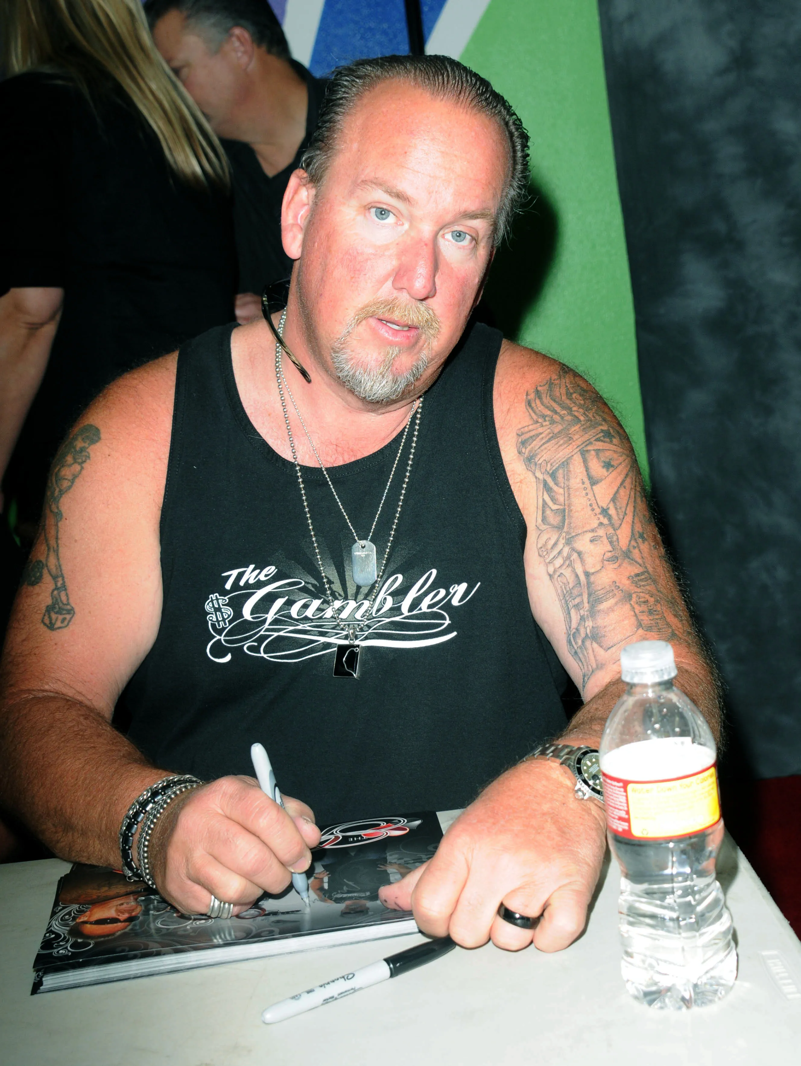 Reality TV personality Darrell Sheets signing autographs.