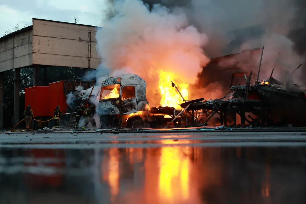 Rescue workers extinguish a fire at a mail sorting center in Zaporizhzhia, Ukraine, following a Russian air guided bomb strike.