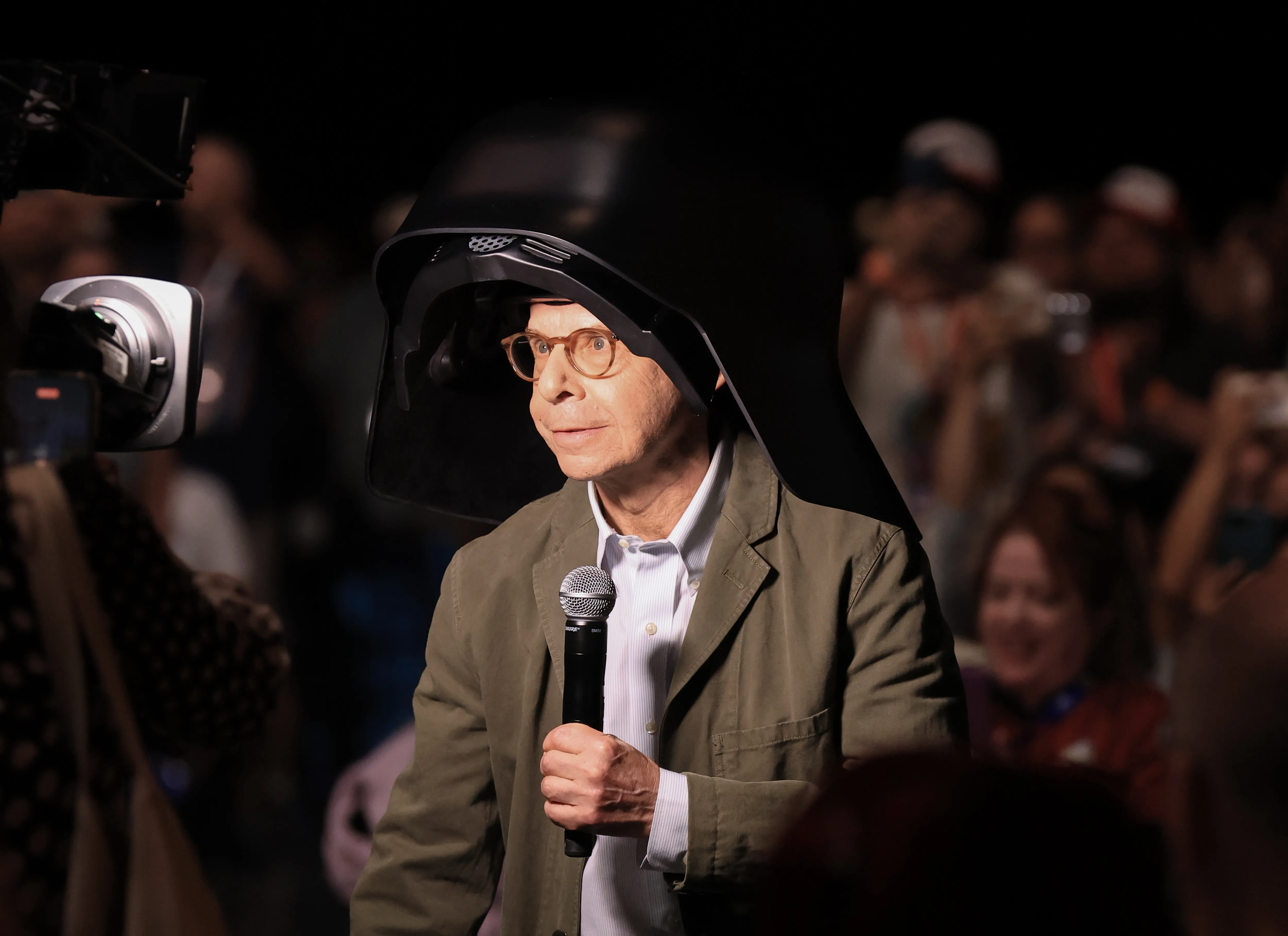 Rick Moranis wearing a black 