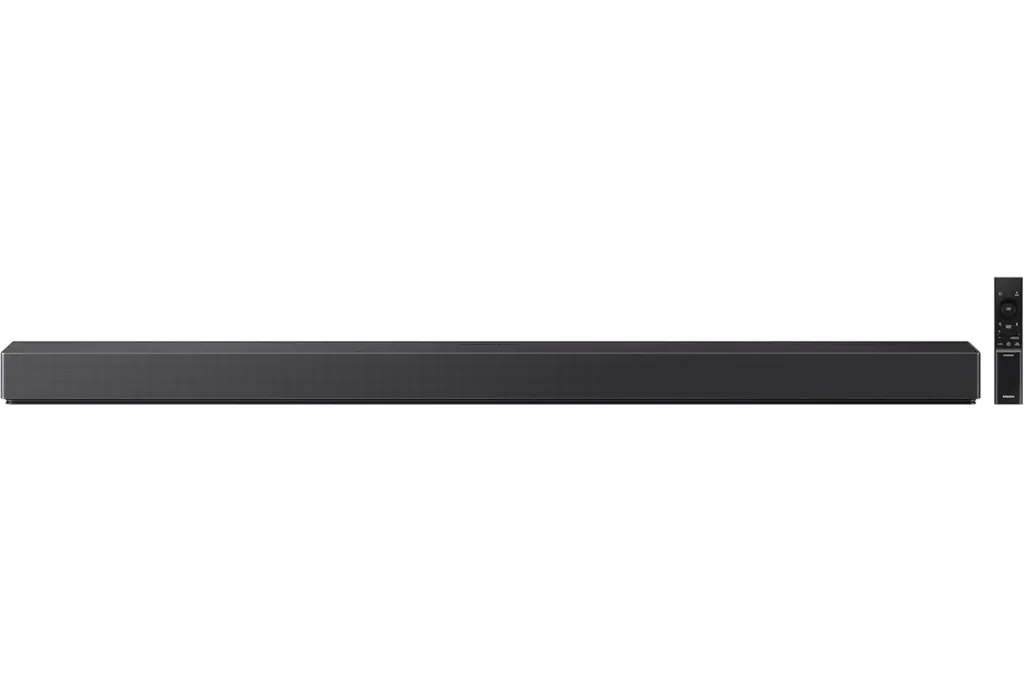 A long, horizontal black soundbar with a matching remote control.