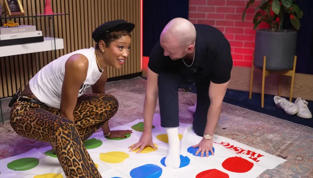 Sean Evans and Keke Palmer playing Twister on Palmer's podcast.