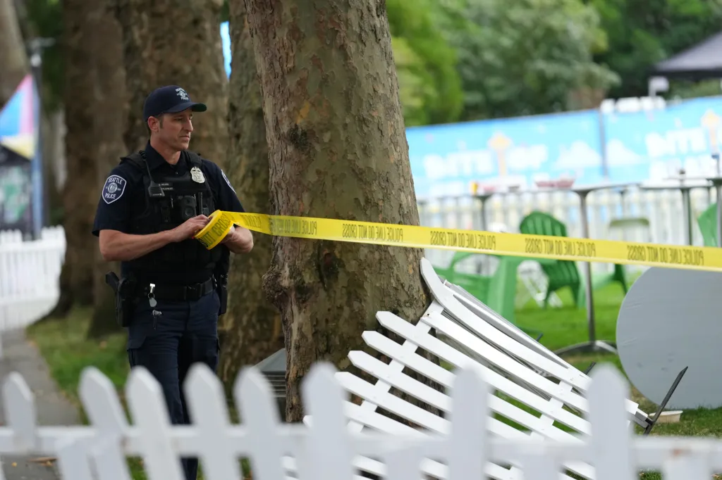 A Seattle police officer sets up yellow 