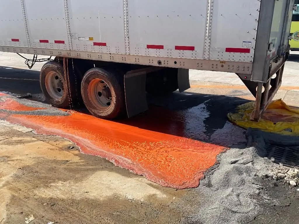 Frank's RedHot sauce spilling from a semitruck onto a highway.