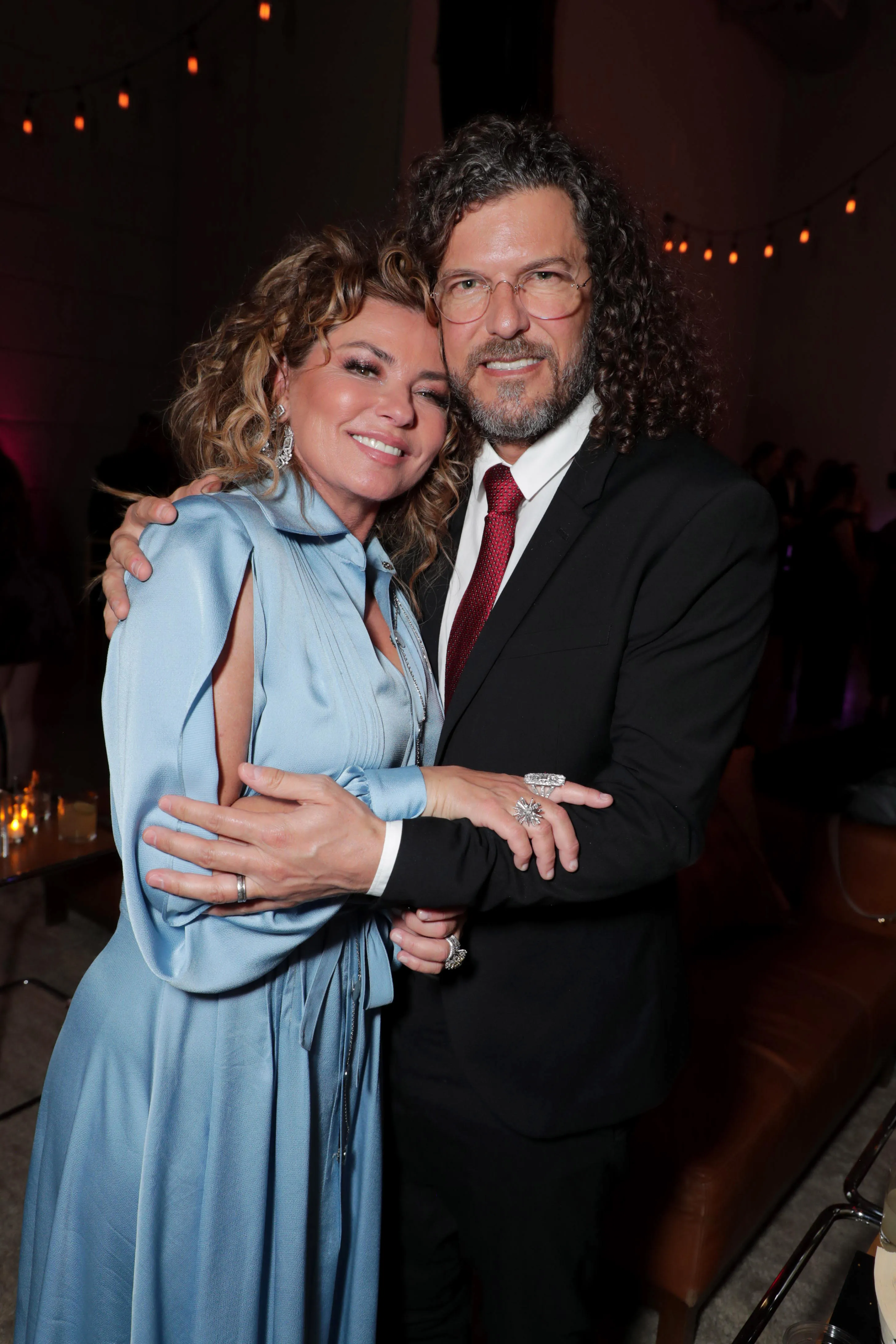 Shania Twain and Frédéric Thiébaud embracing at a screening.