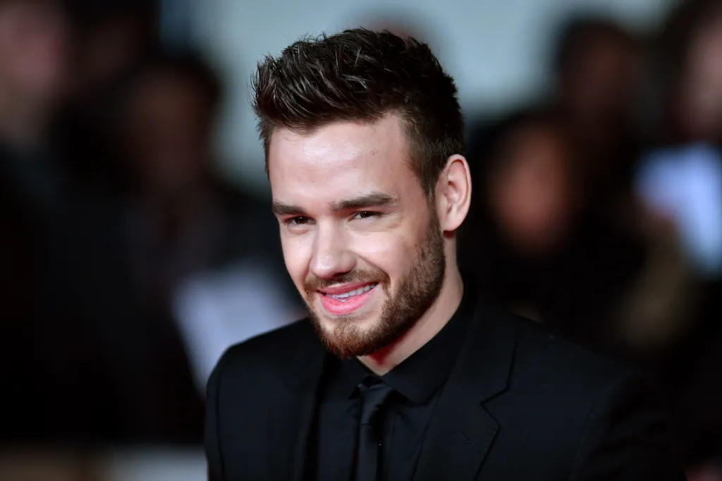 Liam Payne smiling while attending the World Premiere of