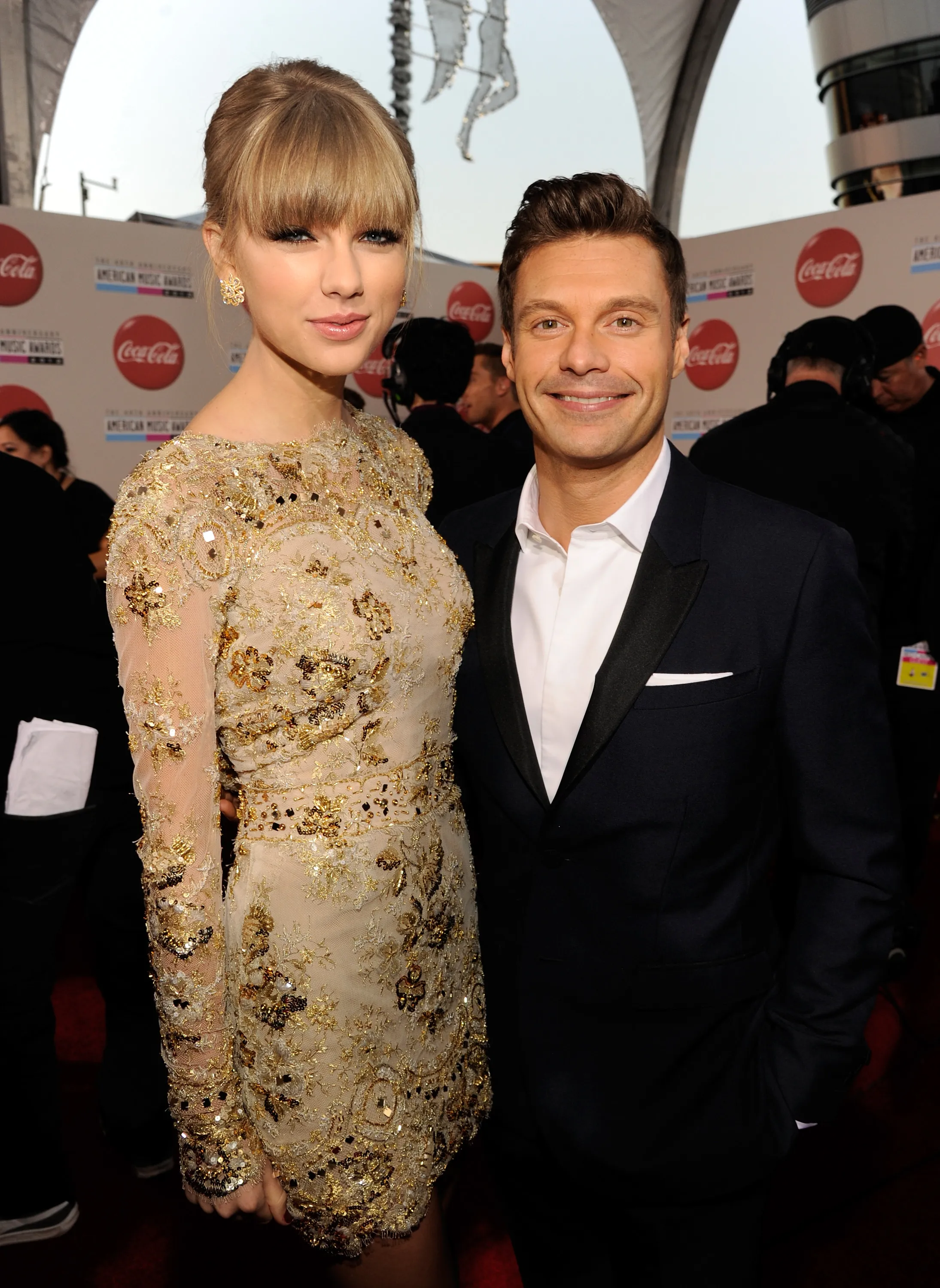 Singer Taylor Swift and television personality Ryan Seacrest attend the 40th American Music Awards.