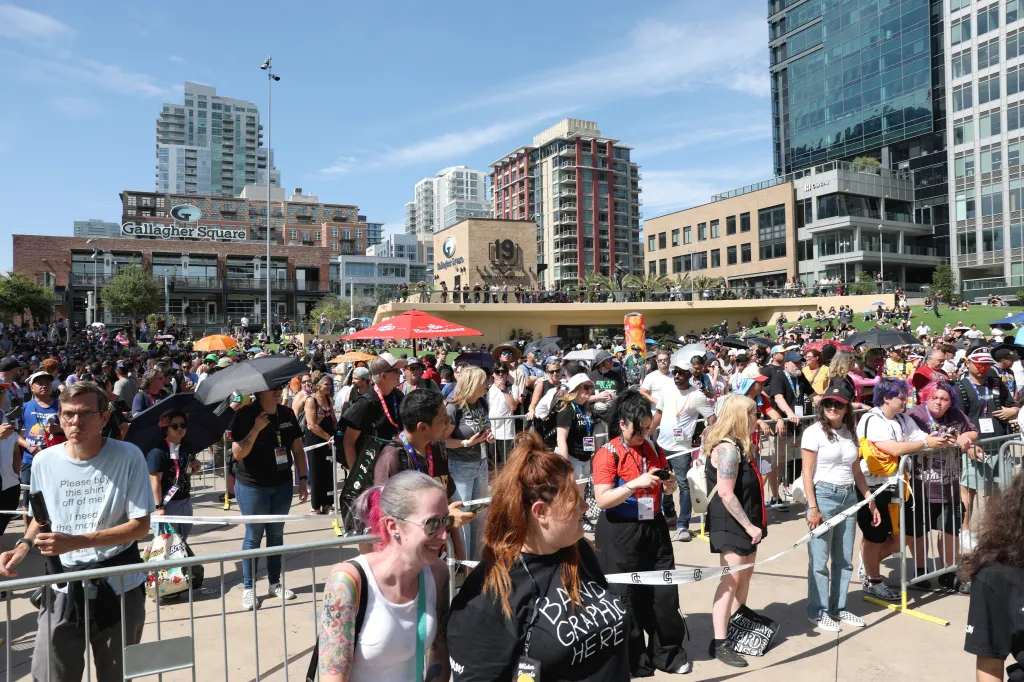 Comic-Con attendees stand outside in the heat of San Diego during a surprise Green Day performance.