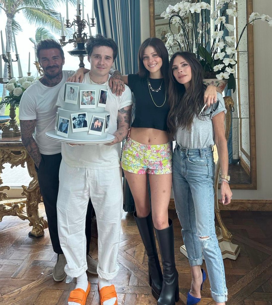 David Beckham, Brooklyn Beckham, Nicola Peltz, and Victoria Beckham celebrate a first wedding anniversary with a tiered photo cake.