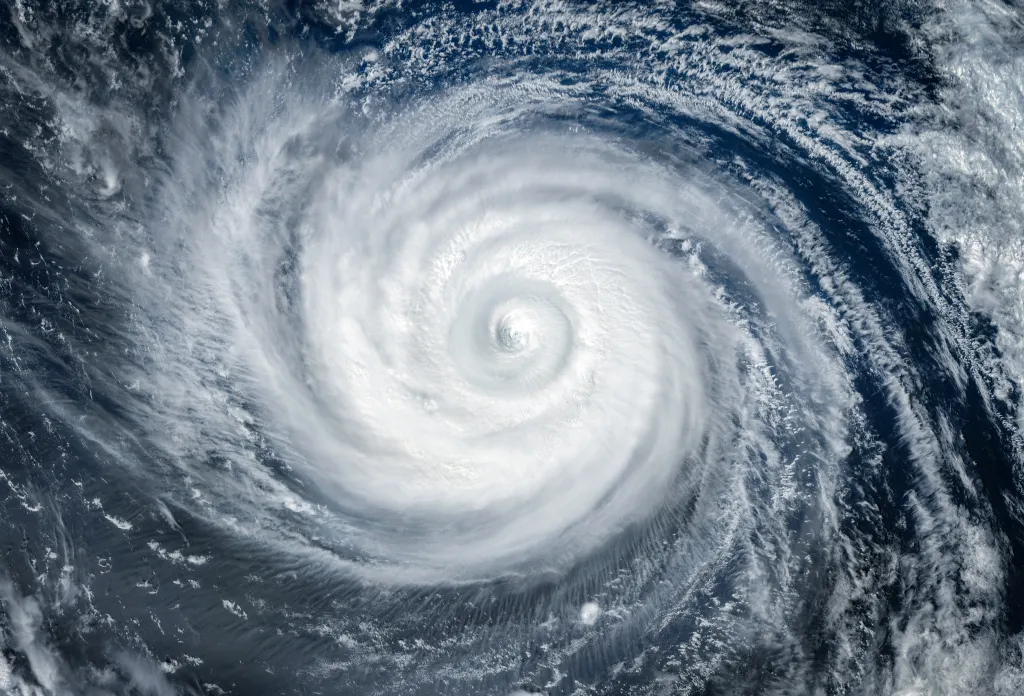 Satellite view of a super typhoon or hurricane swirling over the ocean.