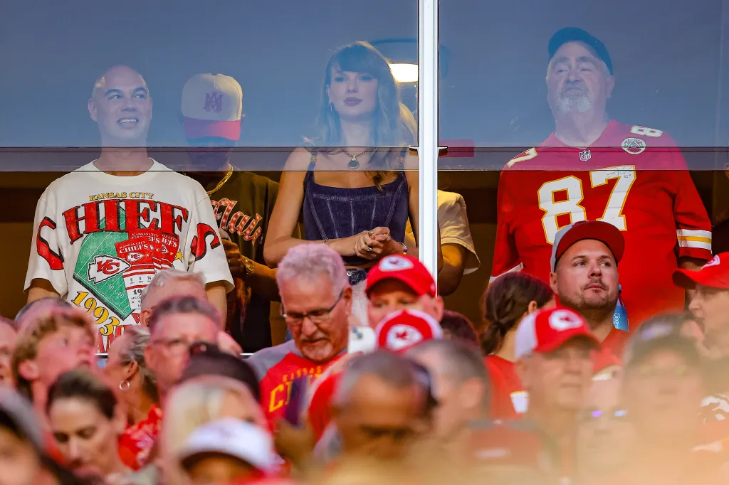Taylor Swift standing next to Ed Kelce at the Kansas City Chiefs game.