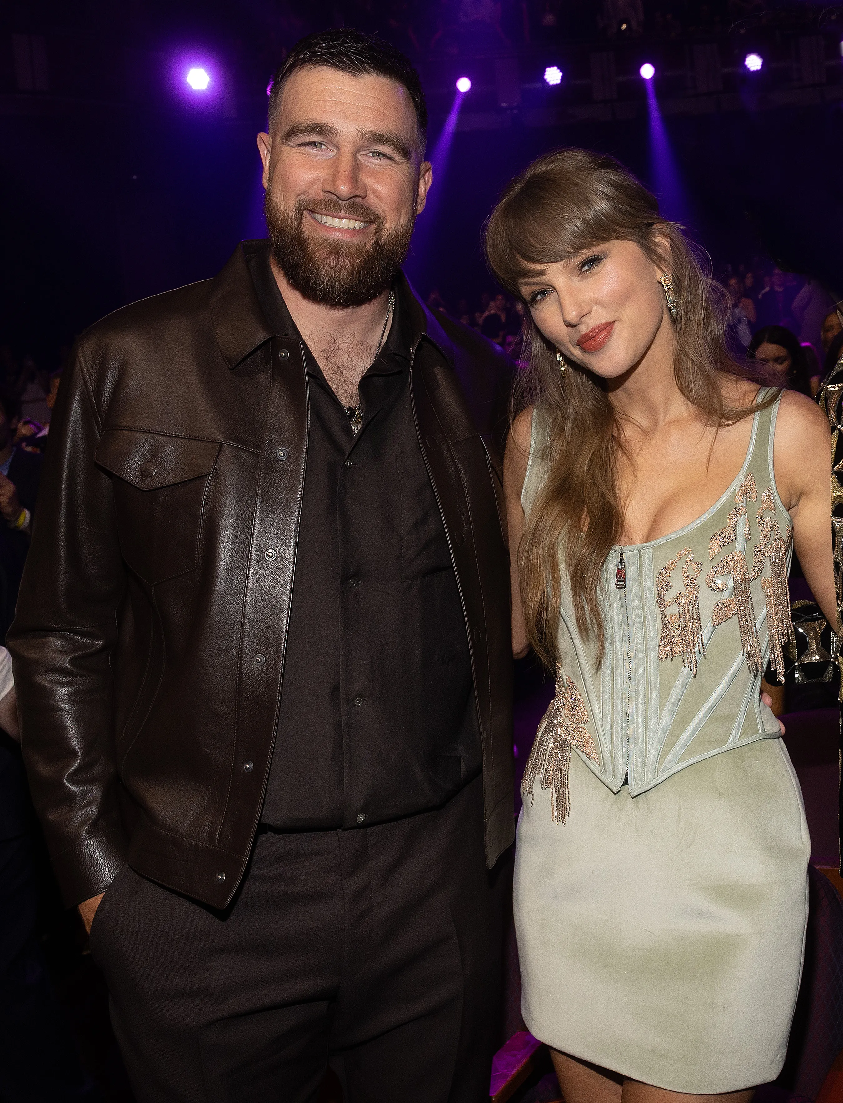 Taylor Swift and Travis Kelce posing at the 2026 iHeartRadio Music Awards.