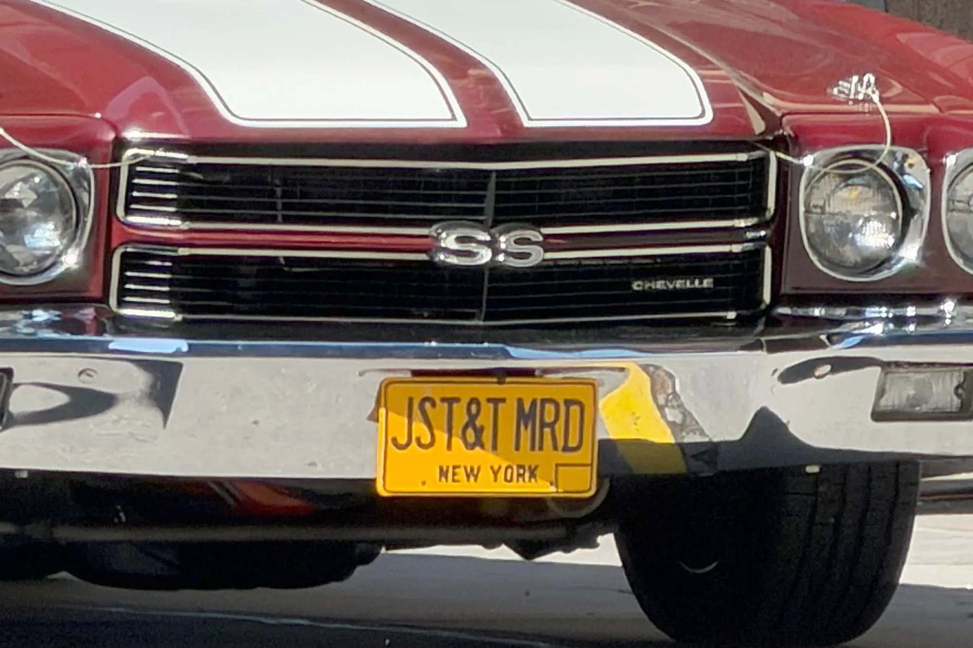 Red Chevrolet Chevelle with a vanity license plate that reads