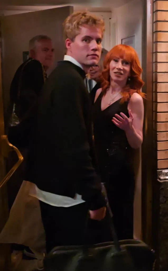 Comedian Kathy Griffin reacts to the New York Knicks parade with her assistant while leaving a Broadway show.